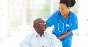 caregiver assisting her patient